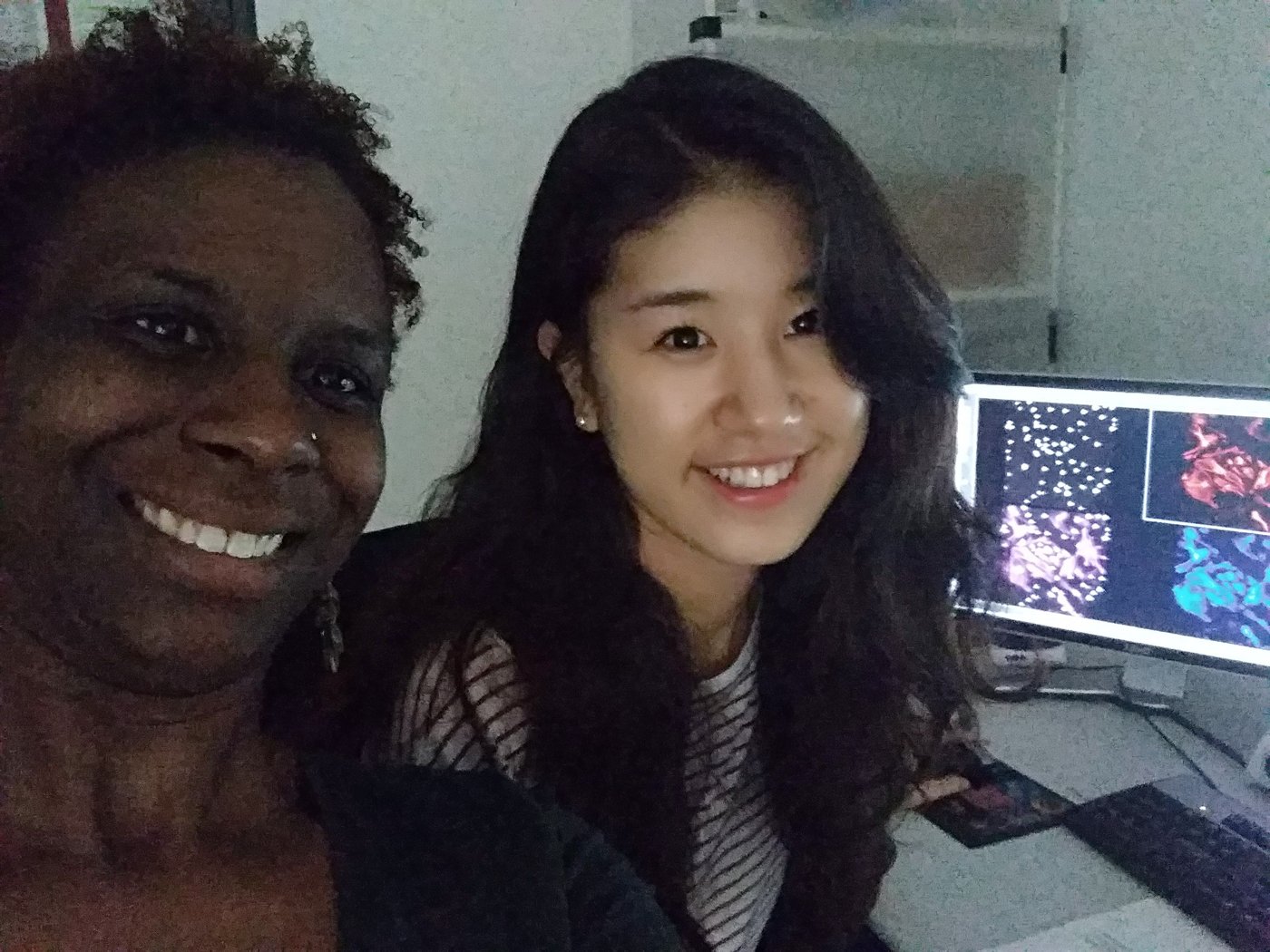 With a student, microscopy images on screen